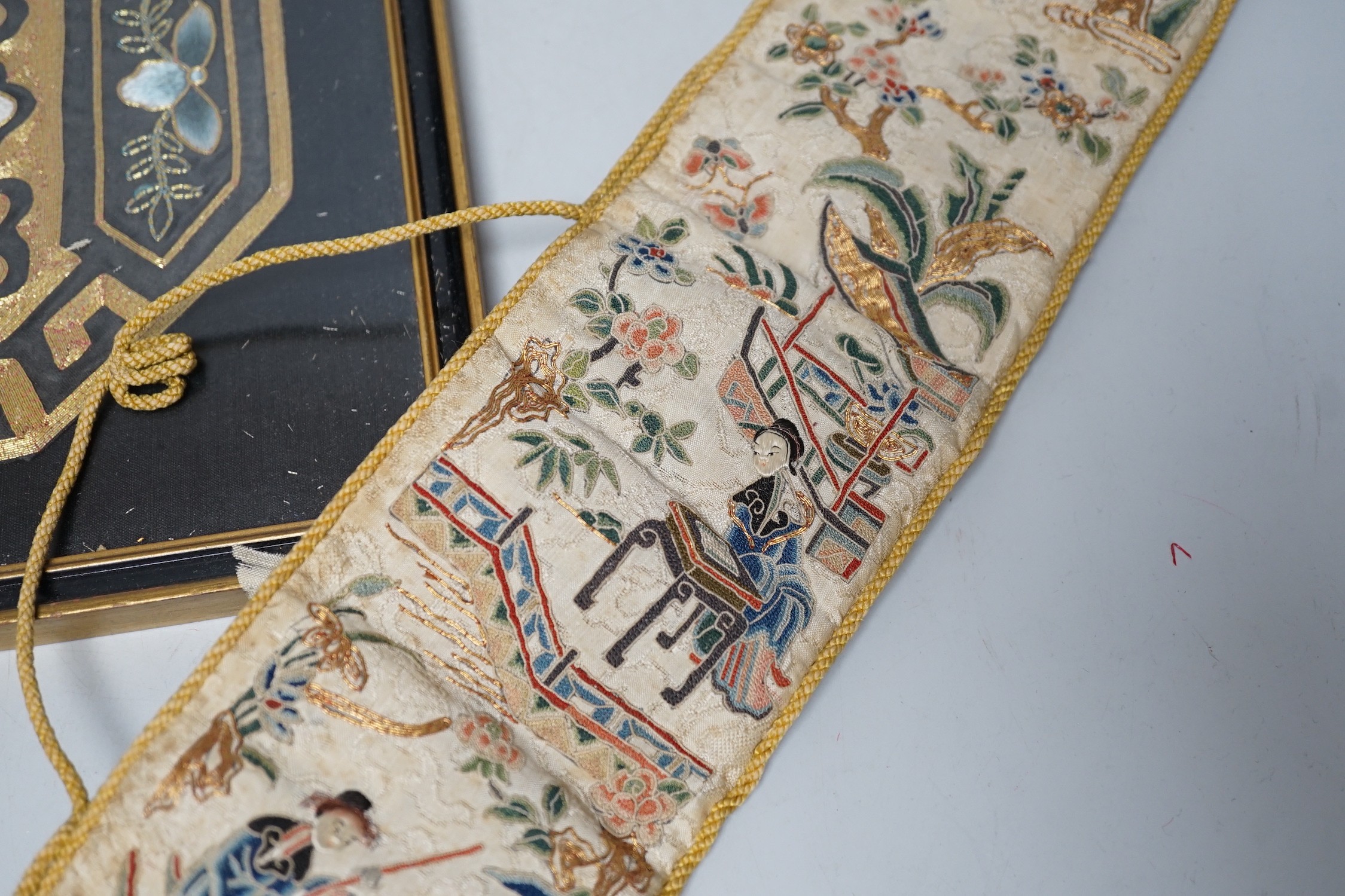 A pair of Chinese 19th century figurative sleeve bands, embroidered with polychrome and metallic threads, stitched in Peking knot and a Chinese embroidered silk purse, with a later panel, (3)